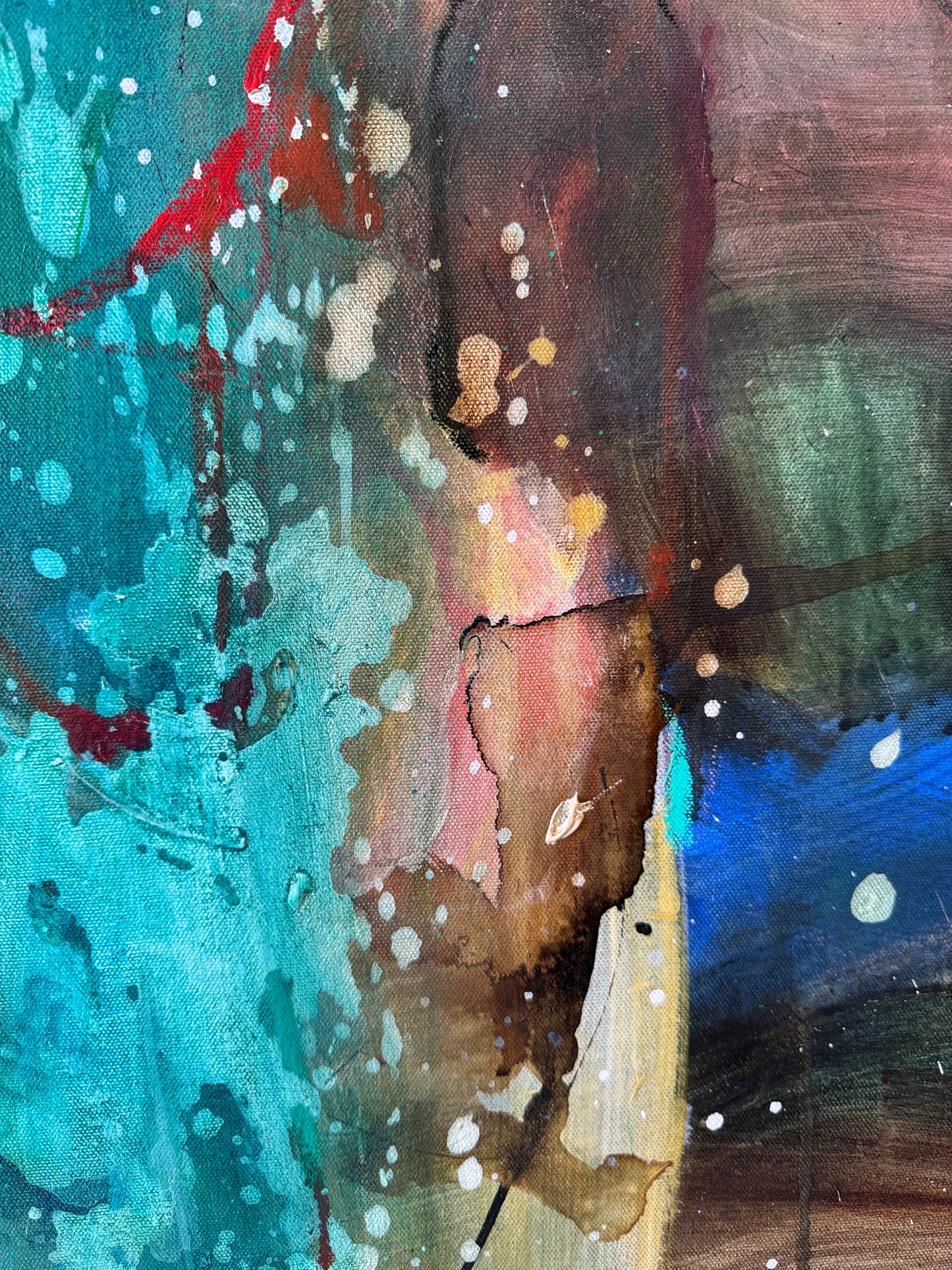 Abstract painting with splashes of blue, red, and brown on a textured surface.