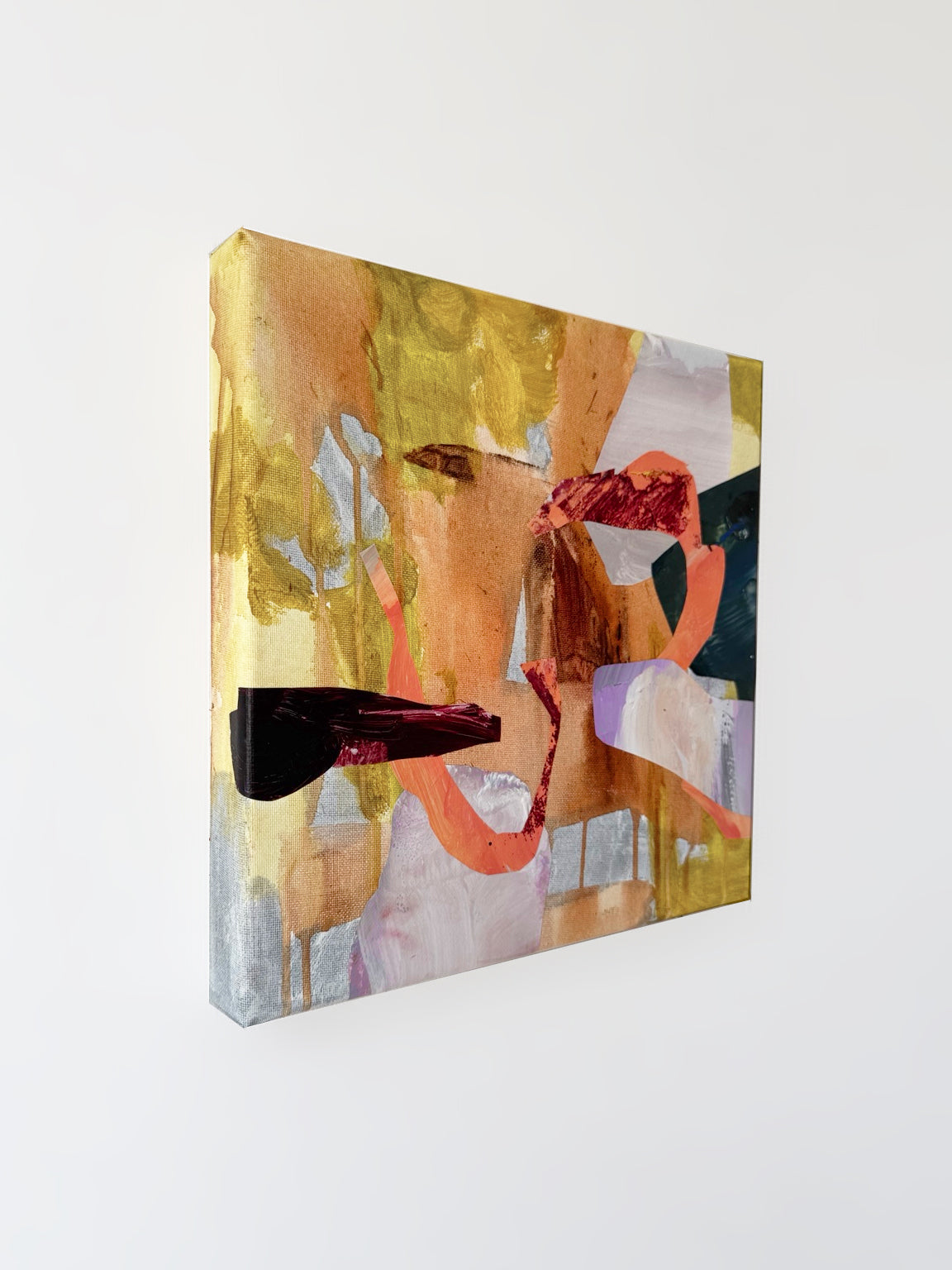 Angled view of A Vein of Light, showing overlapping collage shapes, ochre and peach brushmarks, and the painted left canvas edge.