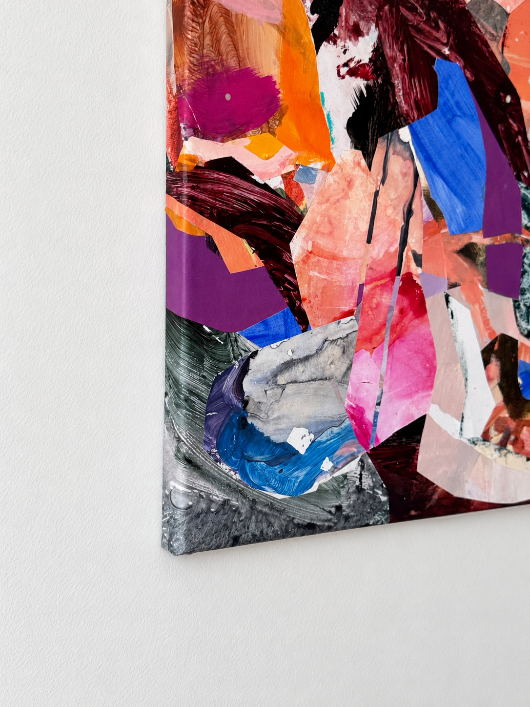Close-up of Held Together showing layered pink, violet, blue and burgundy fragments, visible brushmarks and the lower-left canvas corner.